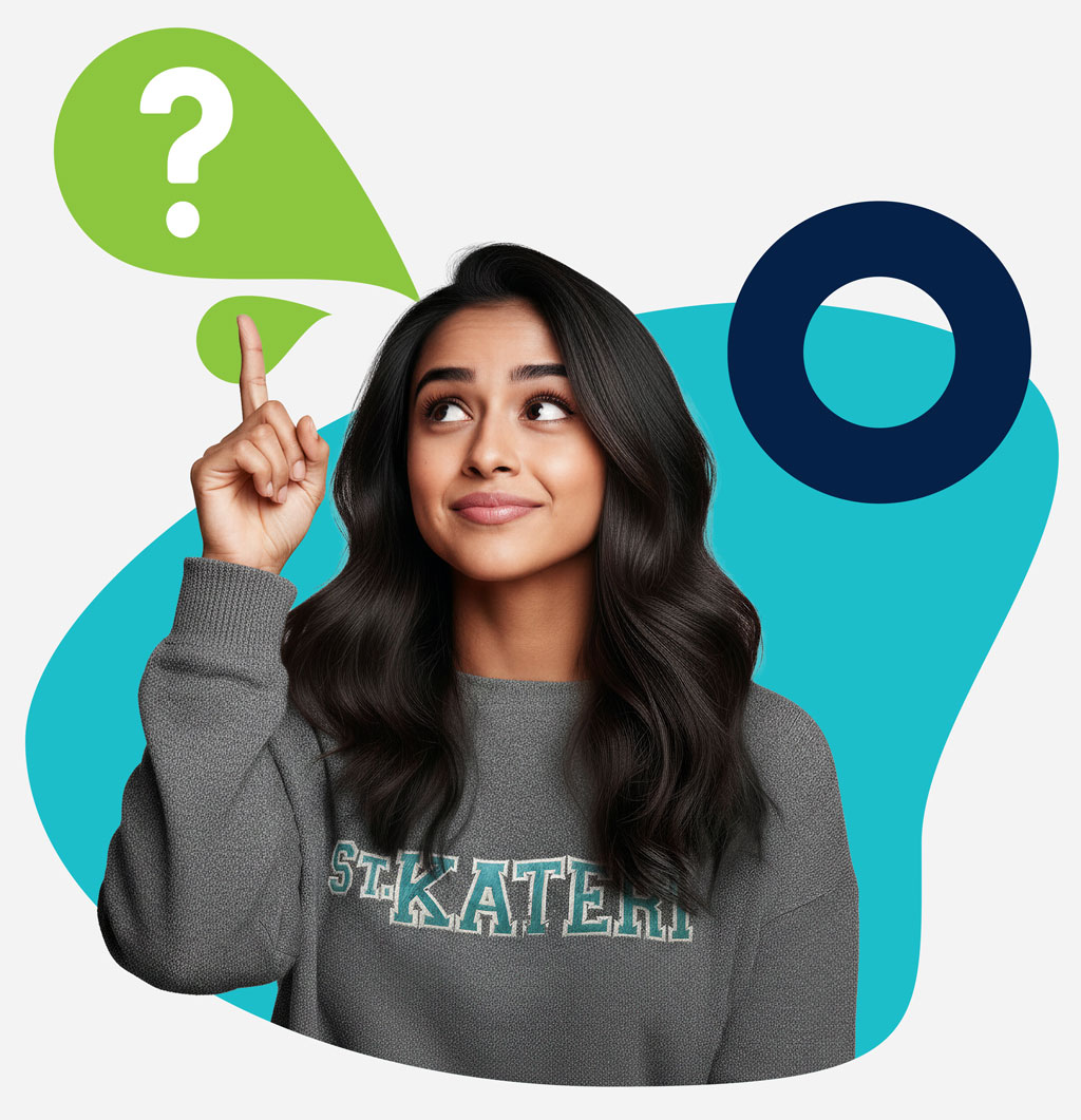 St. Kateri female IB student pointing up to a question mark
